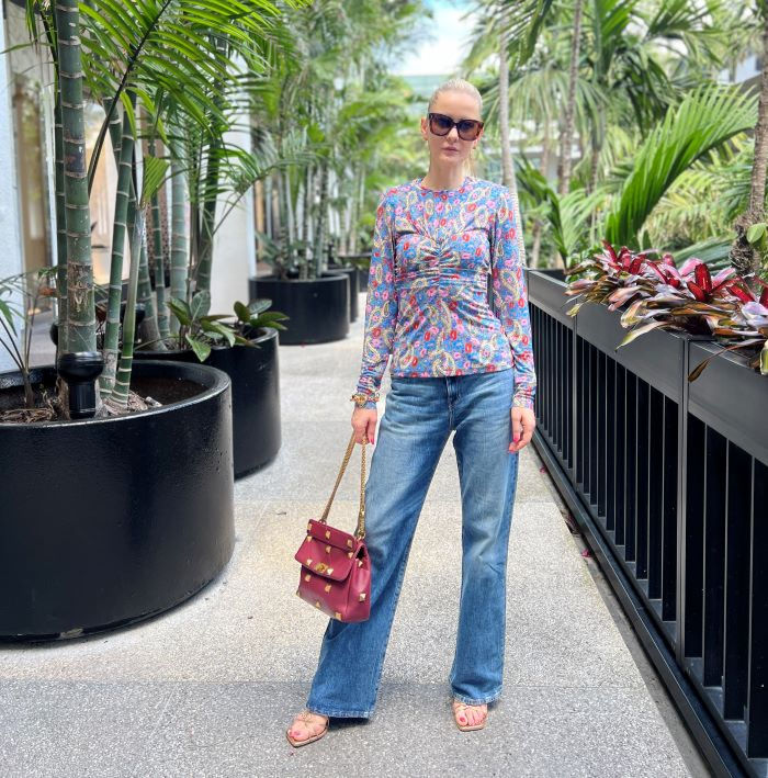 Outdoor shot of Elsa Boutaric with plants background