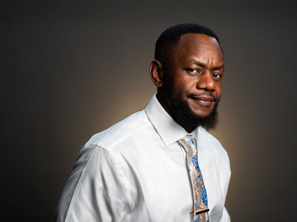 A smiling photo of Denzil T. Tanyanyiwa