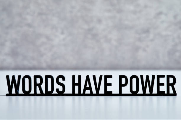 Black text "WORDS HAVE POWER" on a gray textured background, conveying a strong, motivational message.