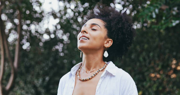 female smiling in happiness taking deep breath