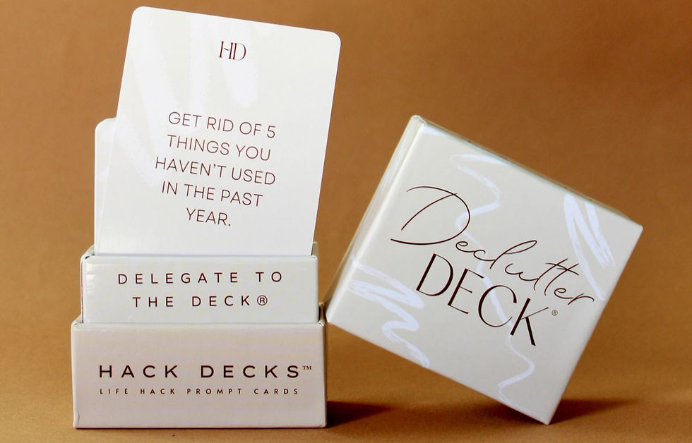 The photo shows a set of "Declutter Deck" life hack prompt cards, with one card displayed that reads, "Get rid of 5 things you haven't used in the past year."