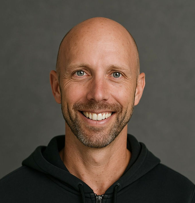 A smiling photo of Justin Edgar
