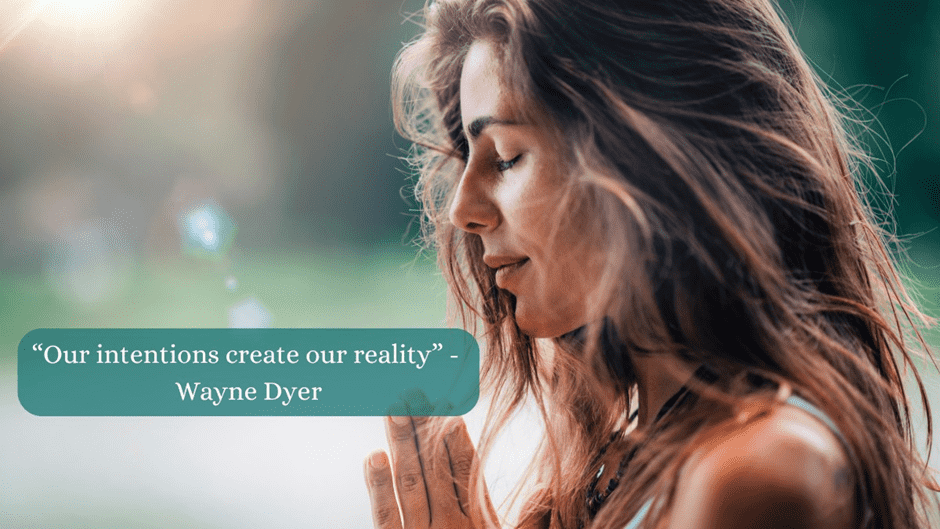 The image features a serene woman with long, wavy hair in a meditative pose, her hands gently pressed together. 