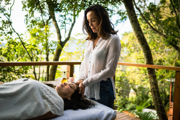 Therapist doing reiki on patient