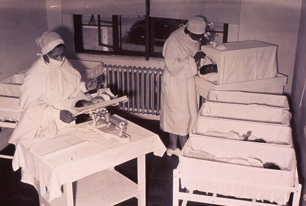 a nurse holding a new born baby