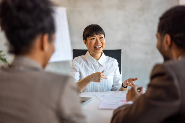 Businesswoman leading business presentation.