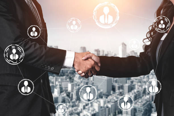 2 business people shake hands