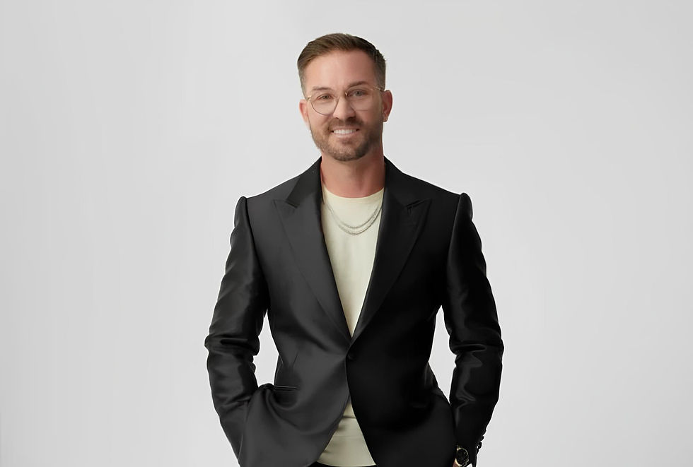 Smiling photo of Tony Hoffman in black suit.