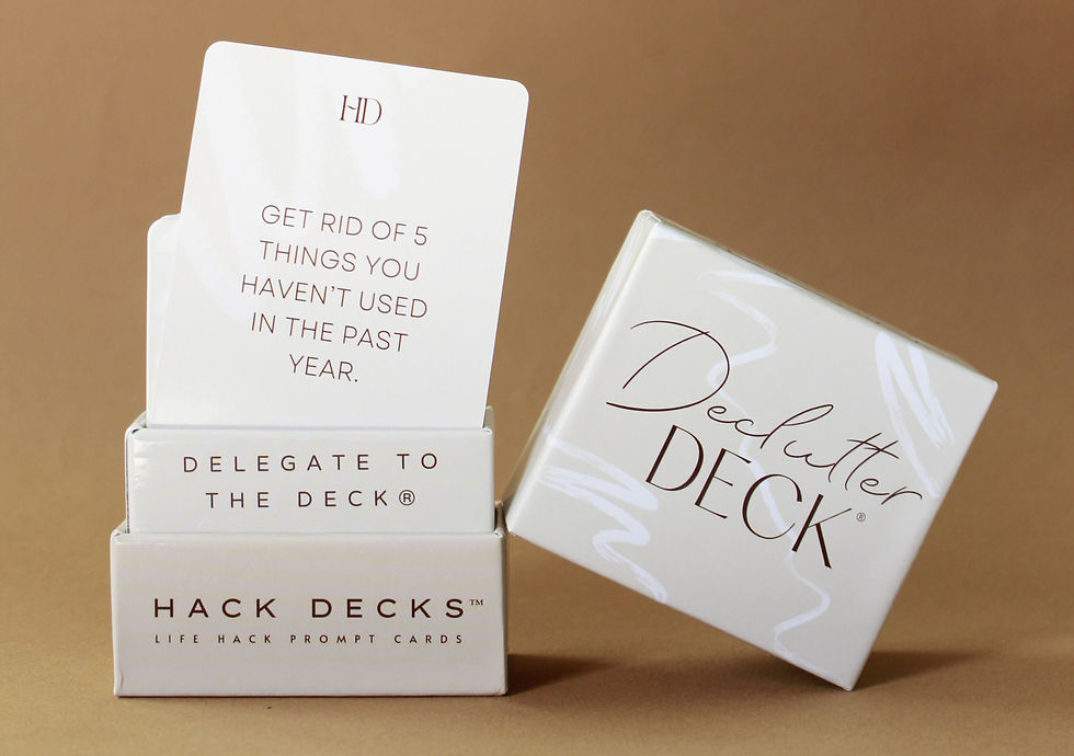 Deck of life hack cards with a visible card saying "Get rid of 5 things you haven't used in the past year," set against a brown background.