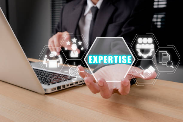 Business person hand holding expertise icon on virtual screen.
