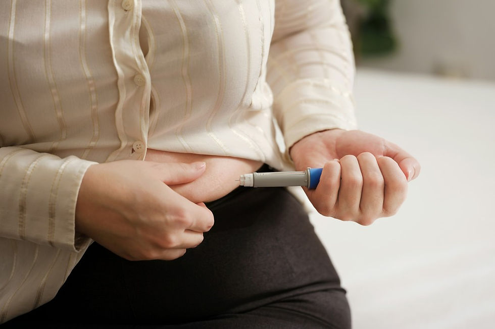Person using an semglutide pen to inject their abdomen, close-up indoors with calm, clinical mood.