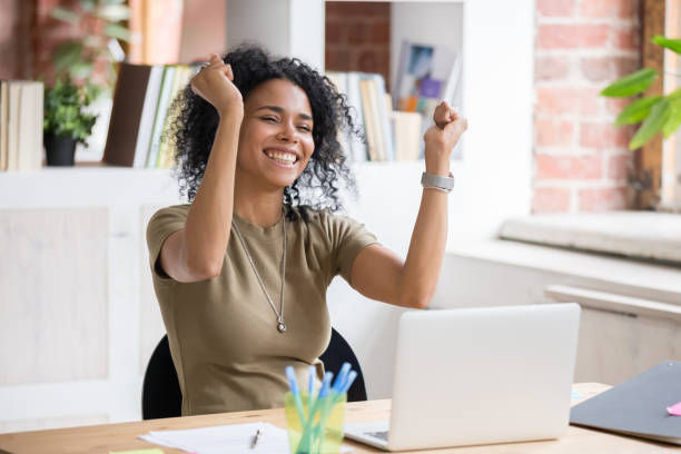 happy woman sit at desk