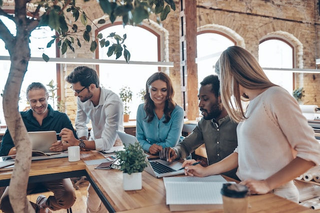 Group of young people in casual talking about business