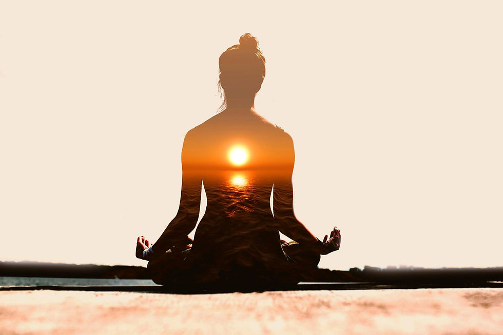 Silhouette photo of a woman in lotus position with sunset