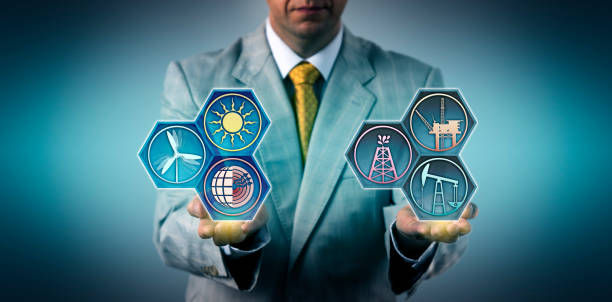 Unrecognizable manager is comparing fossil fuels and renewable energy resources. 