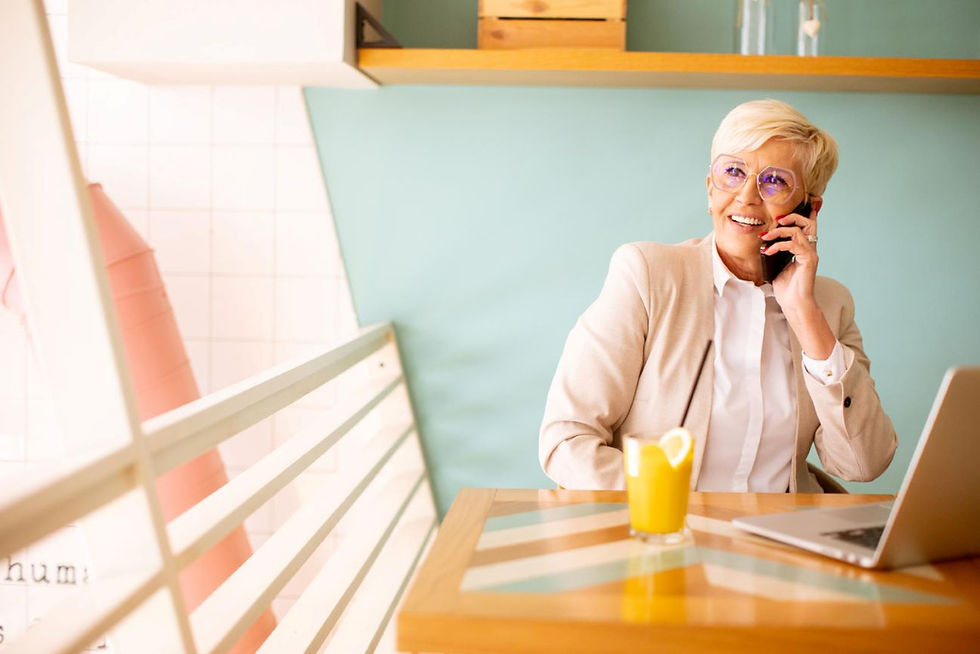 senior woman using mobile phone while working