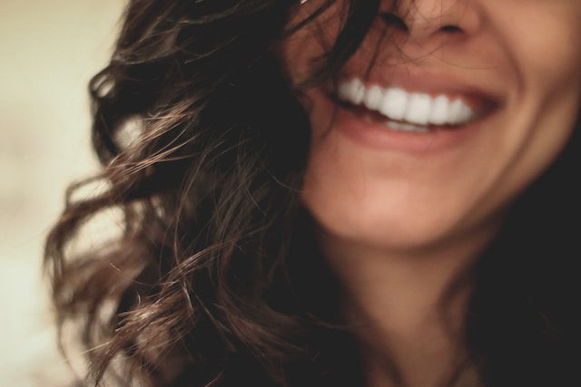 A photo of a smiling woman.