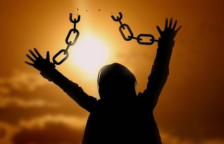 Silhouette of a woman break free from chain