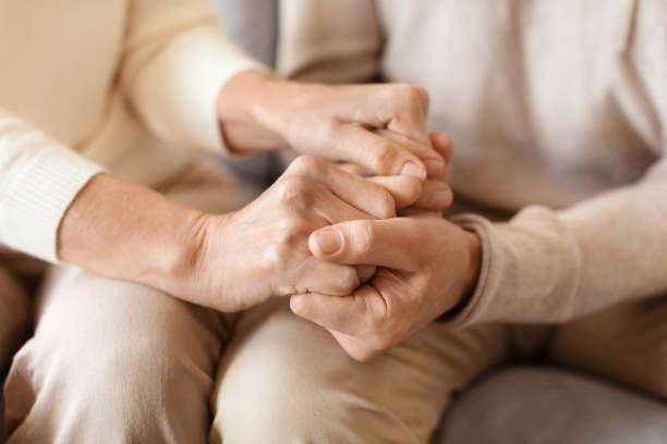 An intimate capture of two people holding hands.