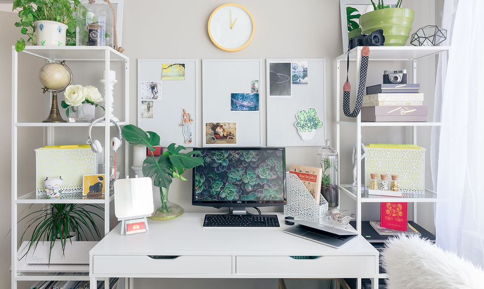 turned on flat screen monitor white wooden desk