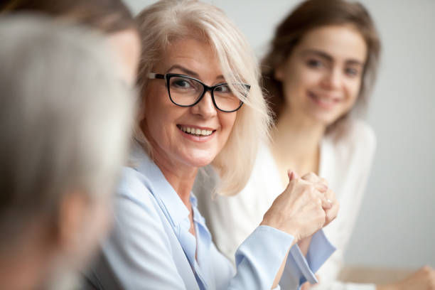 businesswoman looking listening to colleague at team meeting