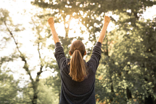 Female power, strong woman with fists up