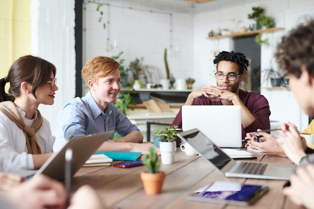 group of employees working together brainstorming