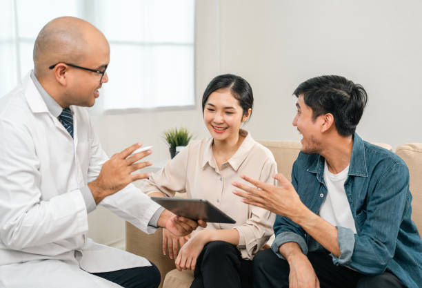 Young couple patients in fertility clinic consulting