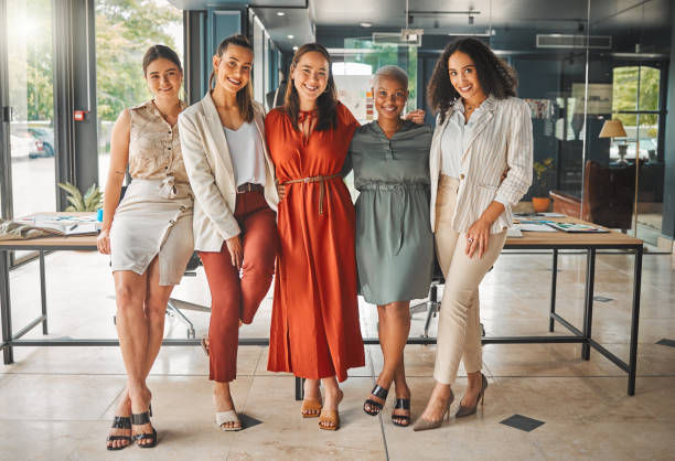 Shot of a group of female designers standing in an office