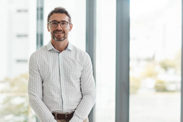Portrait of a mature businessman standing in an office