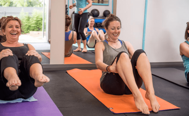 Photo of happy woman doing exercise.