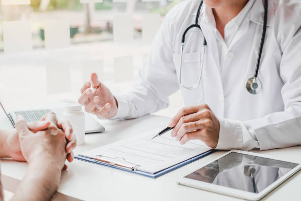 Doctors and patients consulting and diagnostic examining sit and talk. 