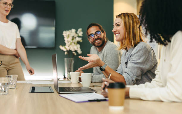 Group of happy business people working together in a creative office.