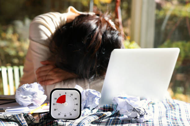 Desperate woman with an impending deadline lying face down on the table