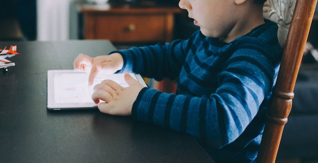 photo of a young child using tablet