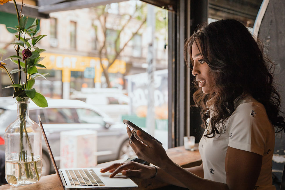 business woman working on laptop in cafe