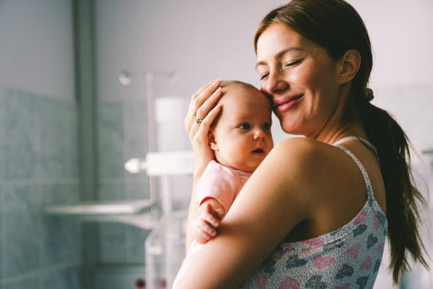 Portrait of a beautiful mother with her newborn baby.