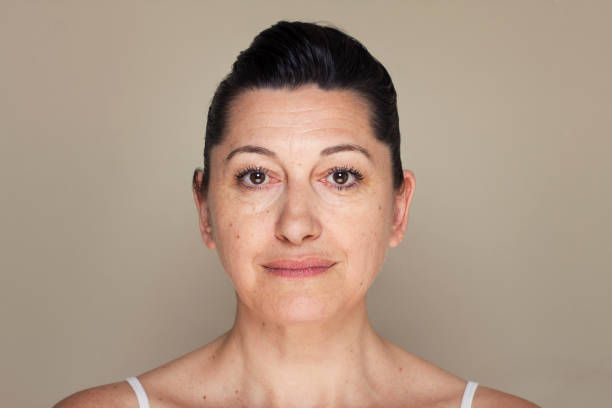 Portrait of woman looking at camera. 
