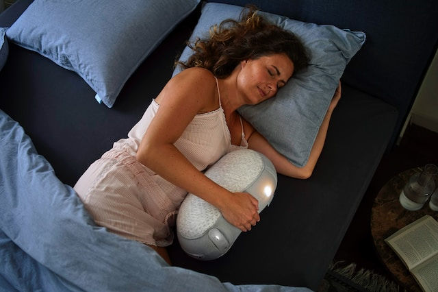 woman in white tank top sleeping