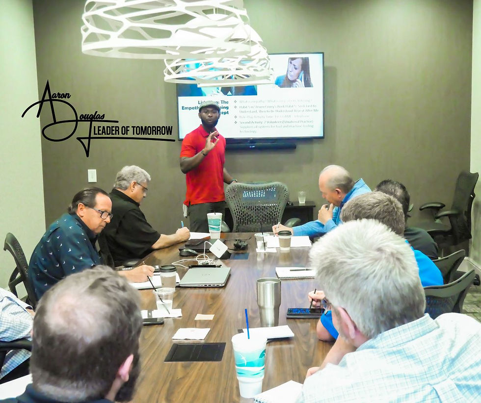 Photo of Aaron presenting at the boardroom