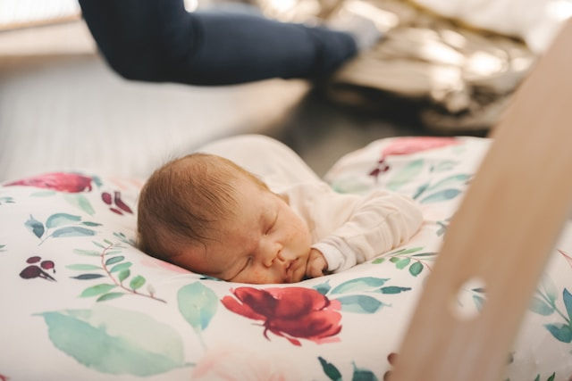 A baby sleeping in a crib