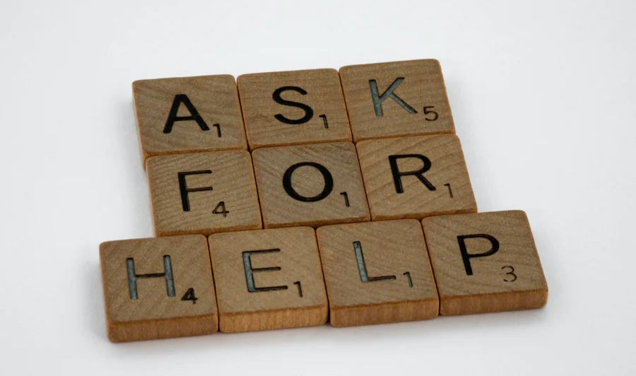Ask For Help, on brown square wood.