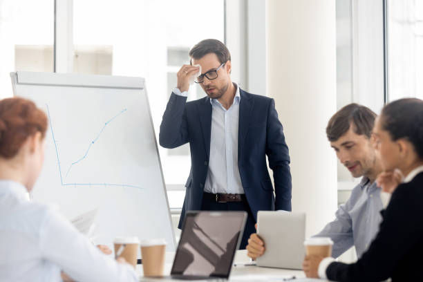 Businessman presenter feel fear panic attack anxious about speech in front of business people. 
