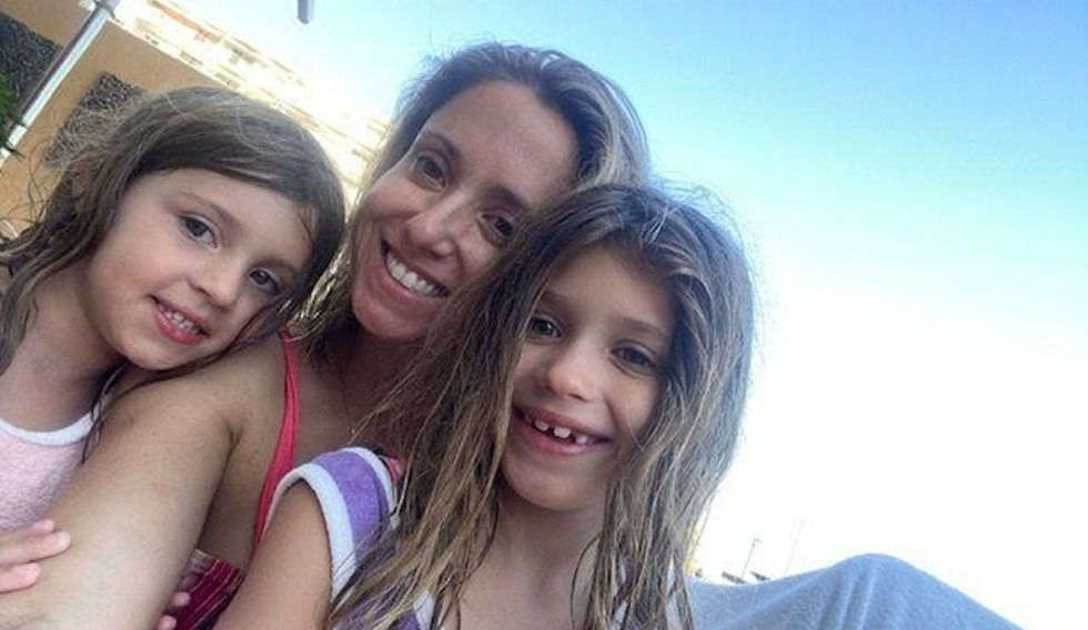 Mother and her two daughter taking a selfie on a sunny day.