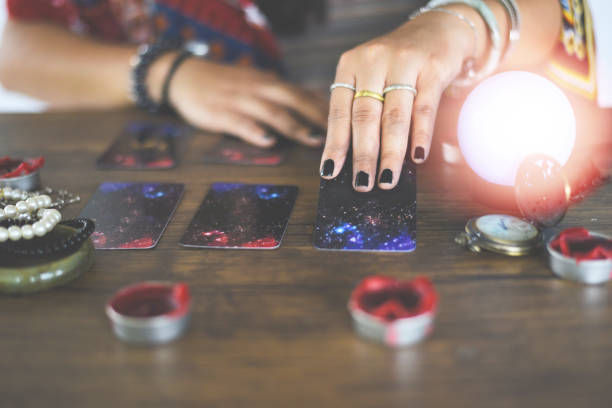 Crystal ball fortune teller hands tarot cards psychic readings.
