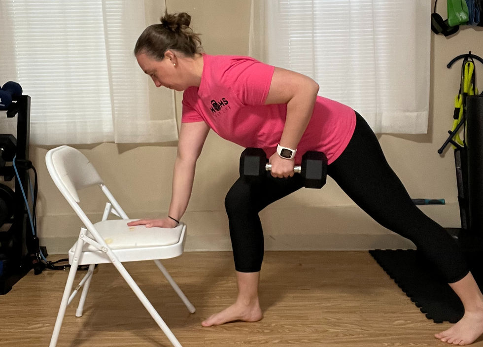woman exercising at home lifting weights.