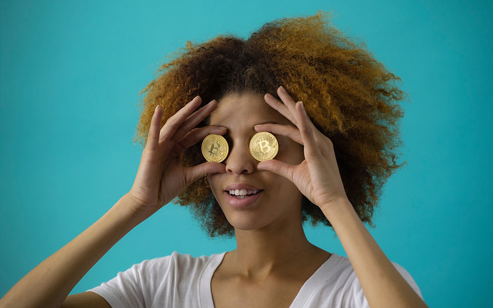 young woman covering her eyes in gold bitcoins