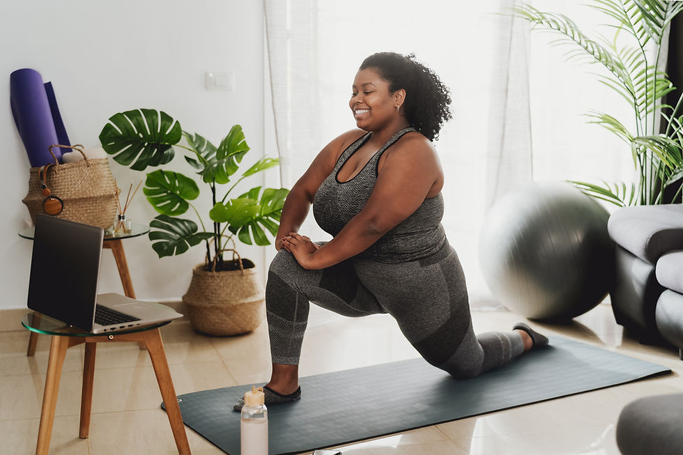 energetic woman doing yoga online class at home.