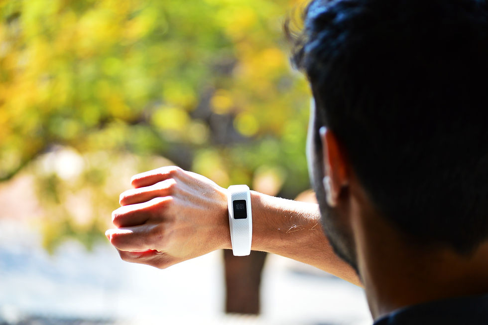 Man looking at activity tracker smart watch. 