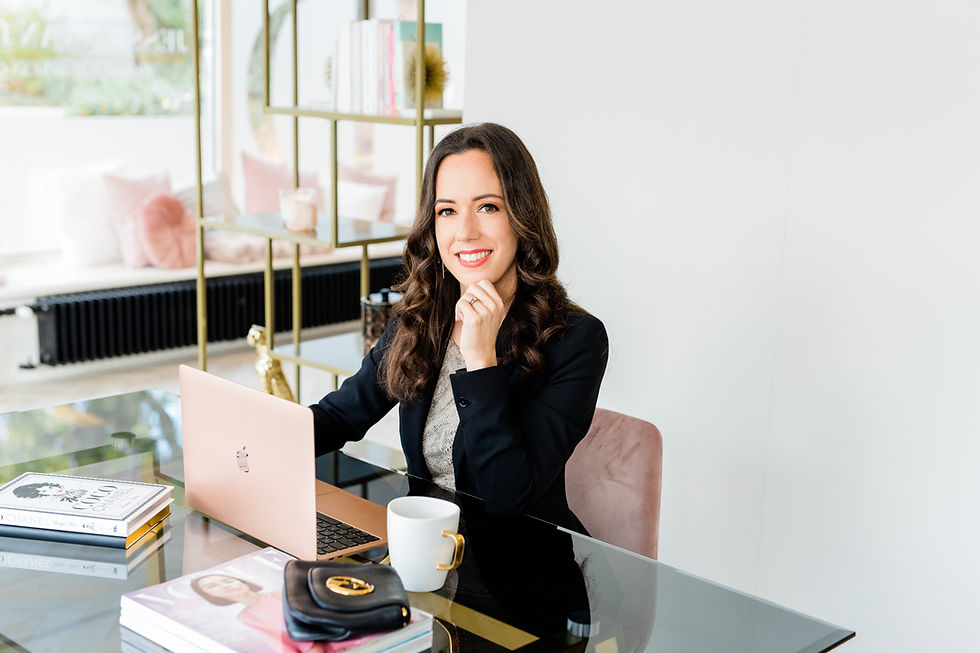 business woman working in her office room smiling at camera.
